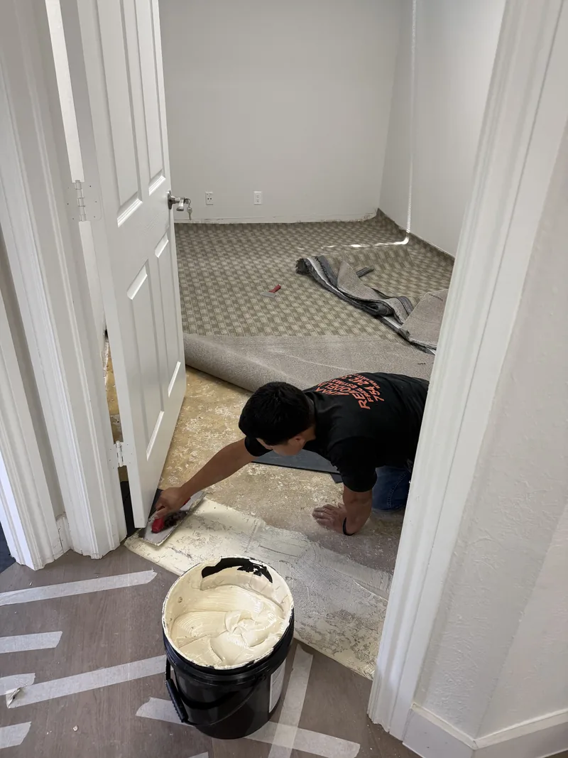 Worker preparing the exposed floor base