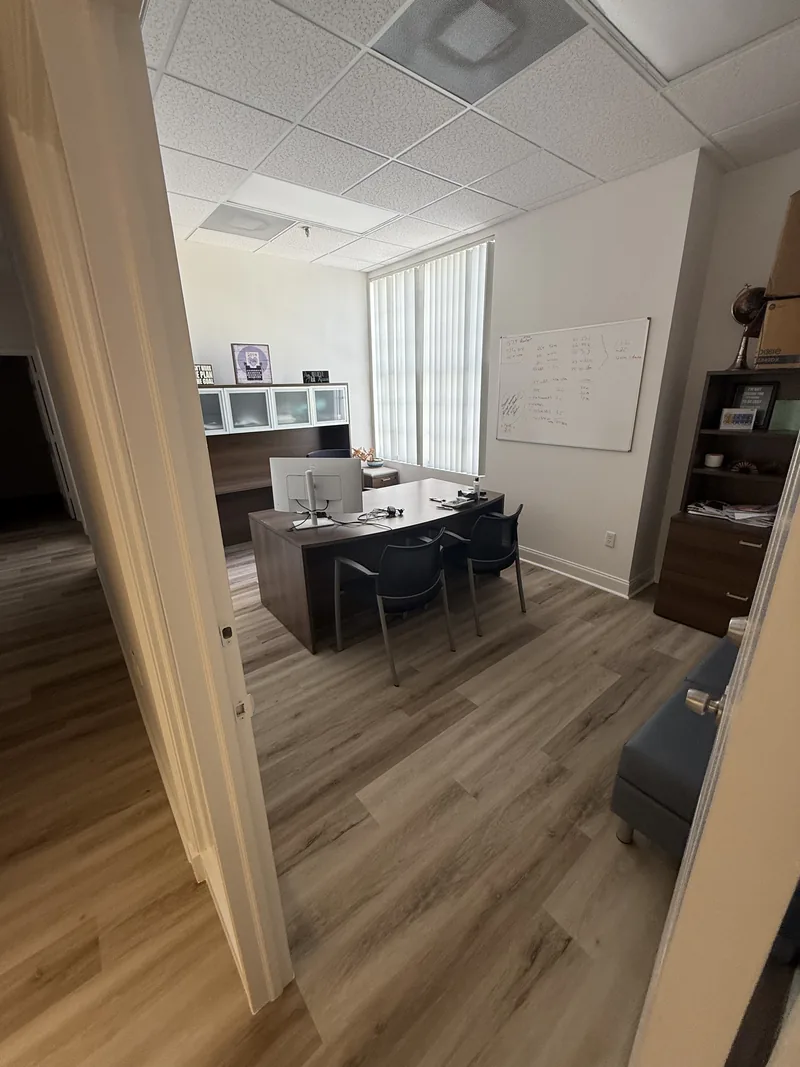 Furnished office with the finished wood-look floor