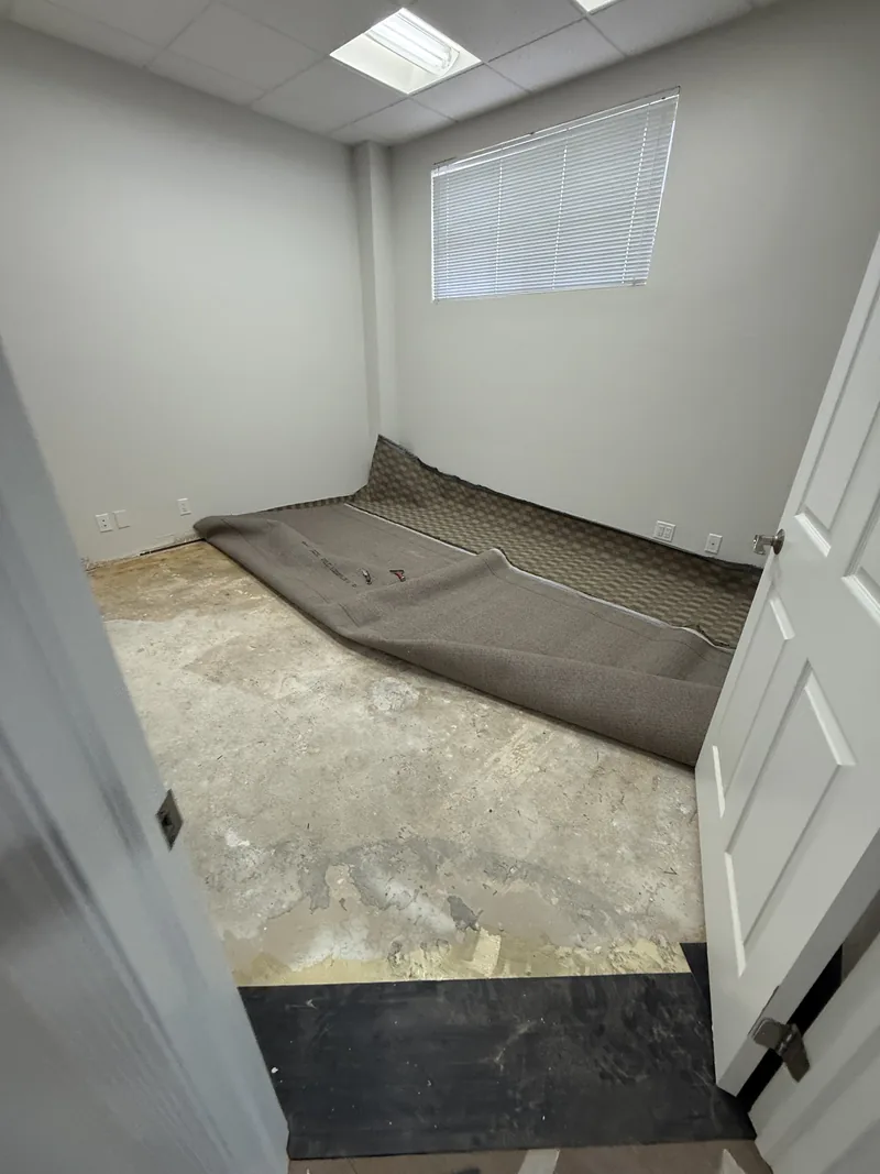 Workspace with the old floor removed and the base exposed