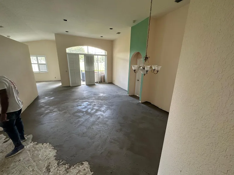 Large room with the concrete base exposed