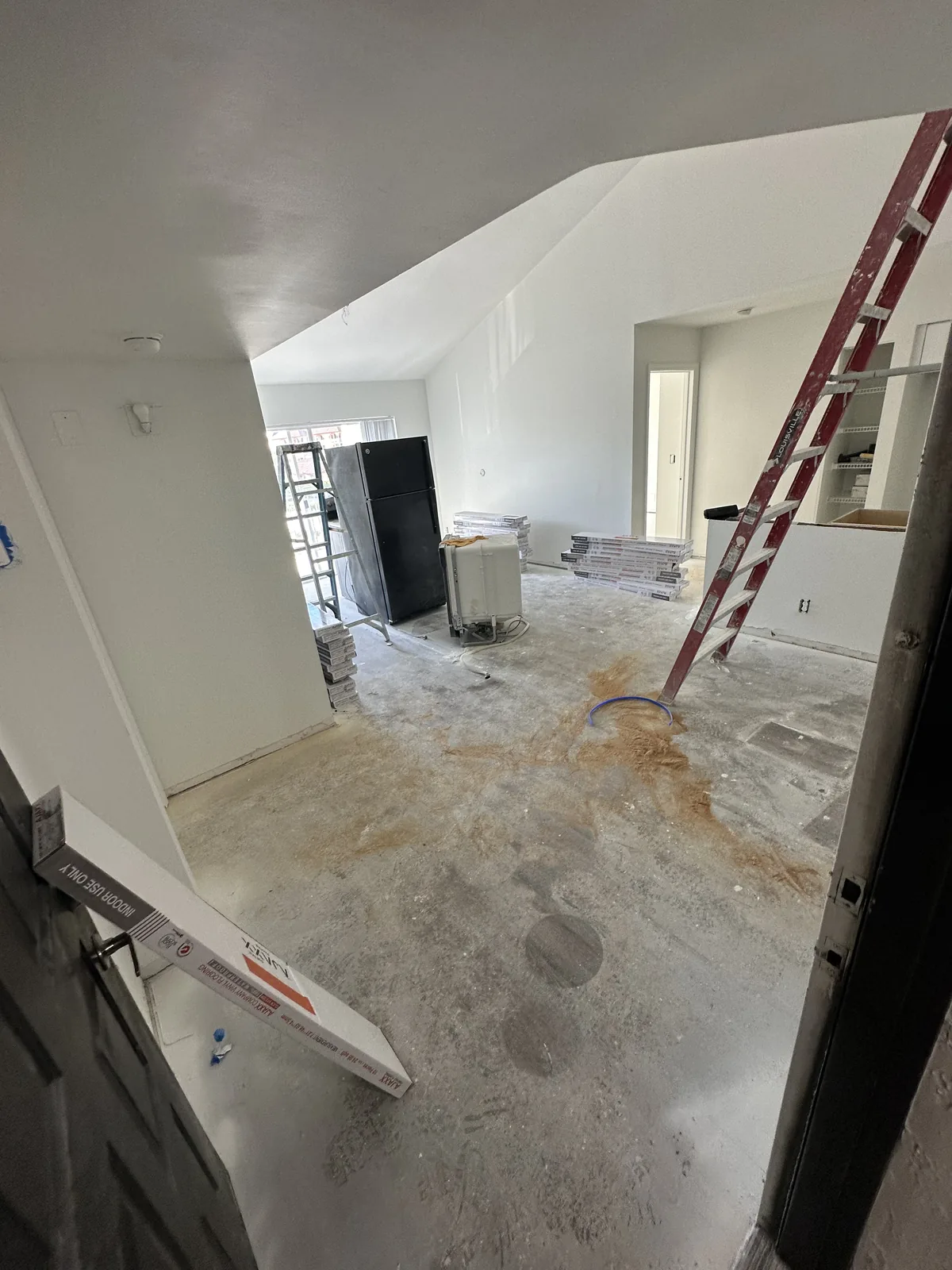 Open interior with drywall and floor preparation active
