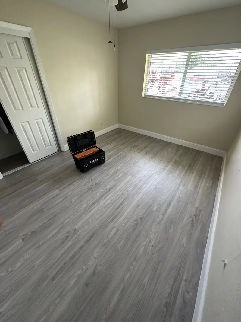 Bedroom with gray-toned flooring in the latest documented state