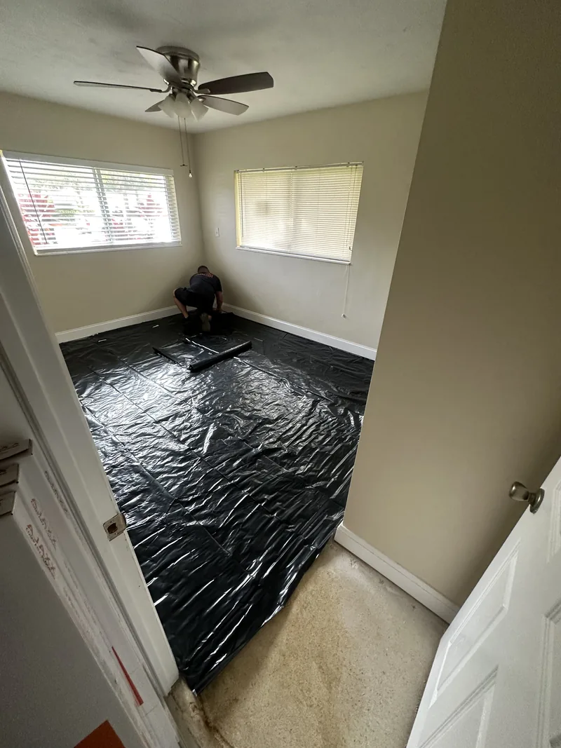 Installer working at the edge of a room