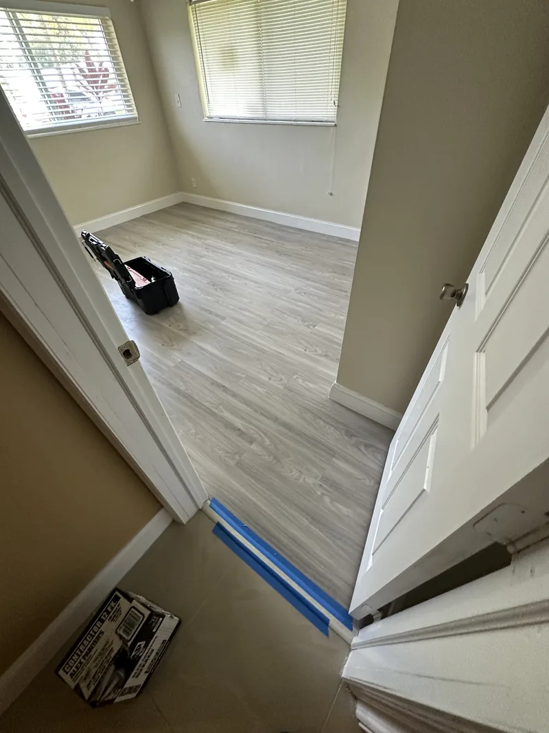 Doorway where the flooring continues from one room into the next
