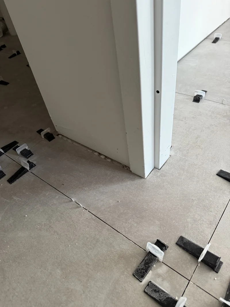Doorway detail with leveling clips in the active installation