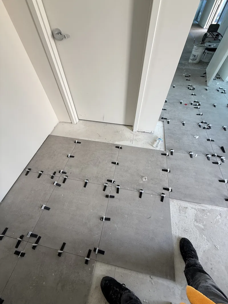 Worker and tools on the flooring installation in progress