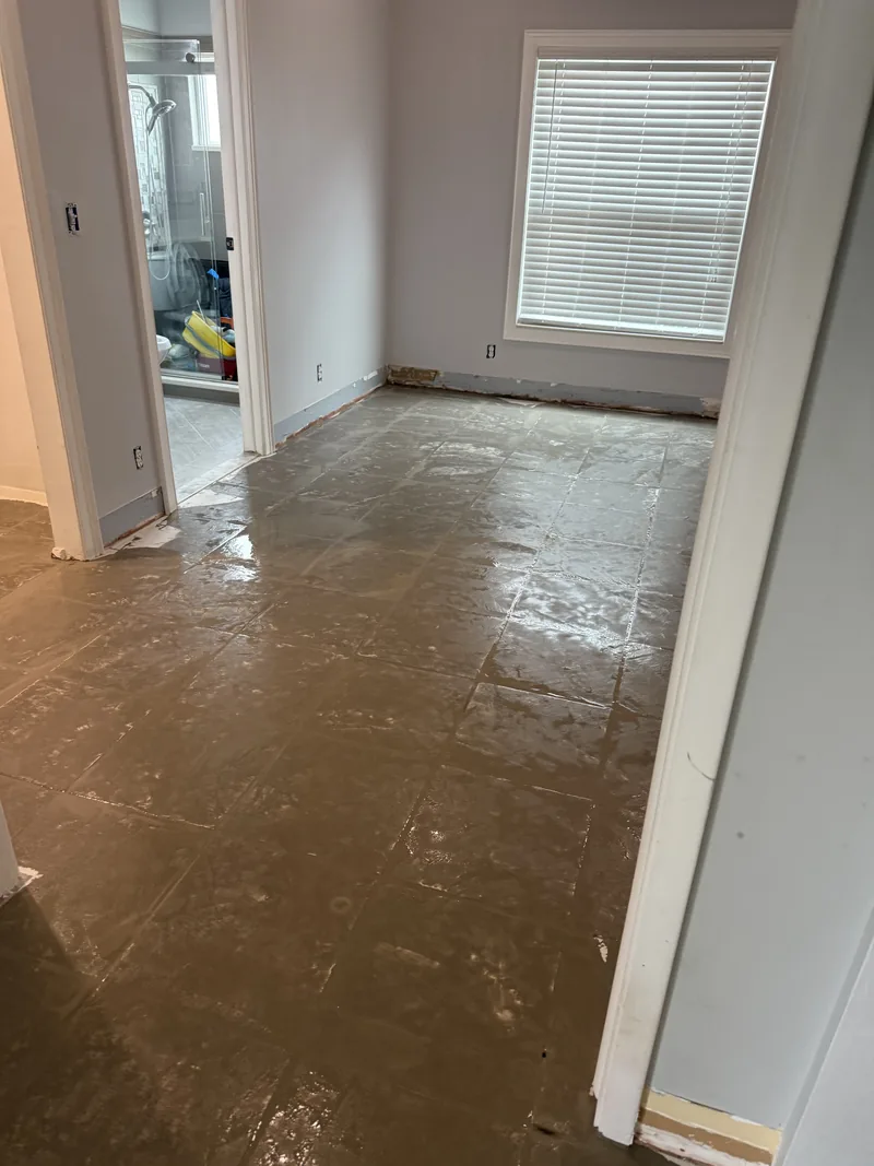 Cleared room with the floor base exposed for preparation