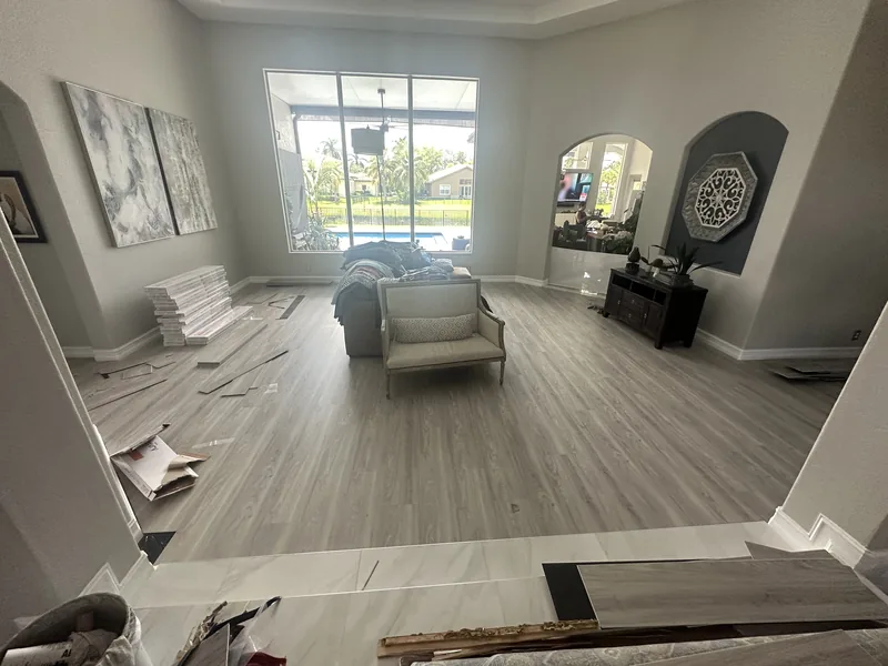 Separate final room documenting the light-toned flooring direction