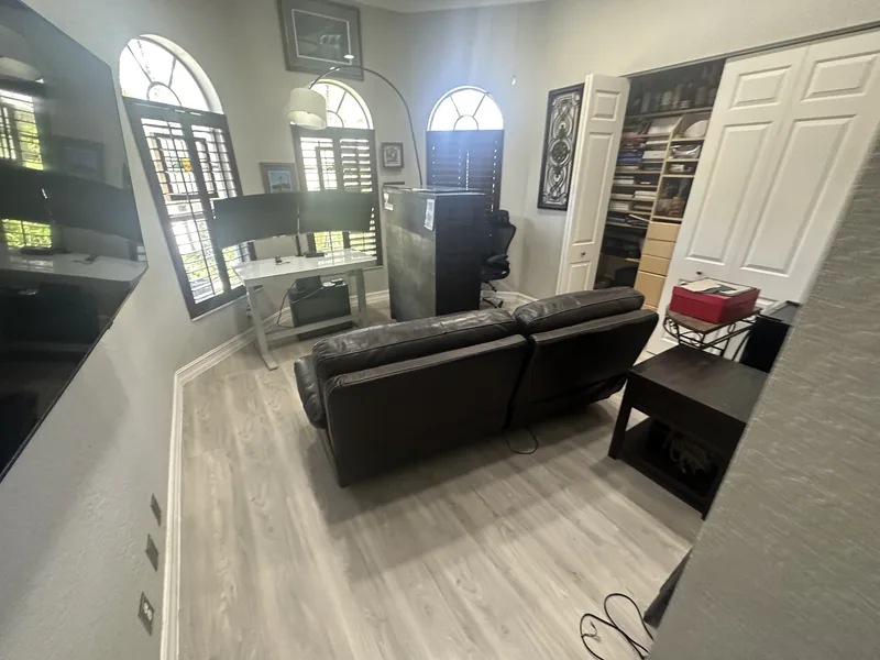 Office documenting light-toned flooring with its own room character