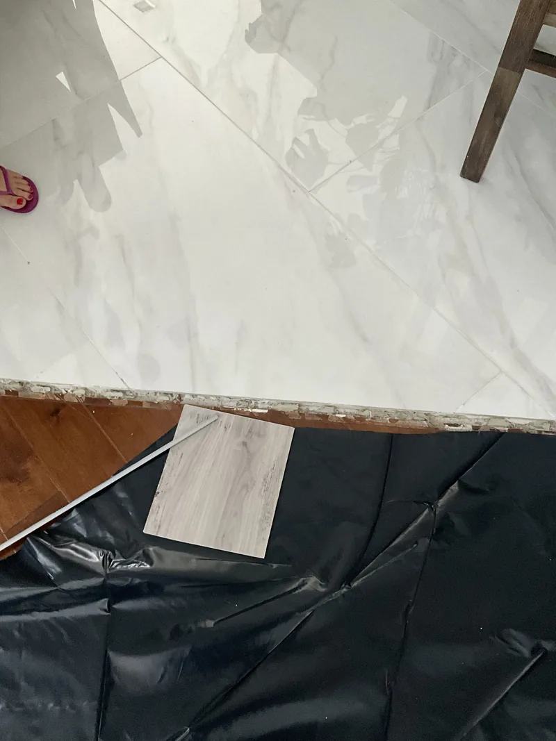 Light-toned flooring sample photographed over another surface