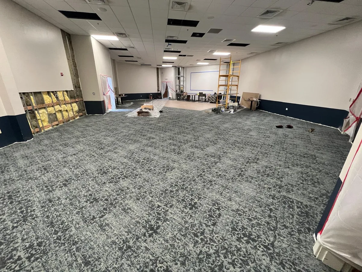 Senior Village hall with carpeted flooring in the current documented state