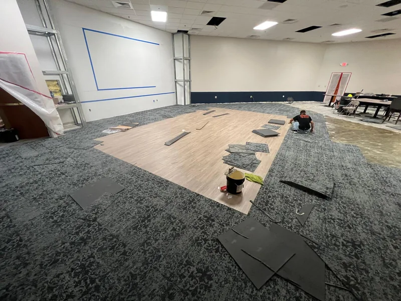 Two flooring zones documented where they meet during the work