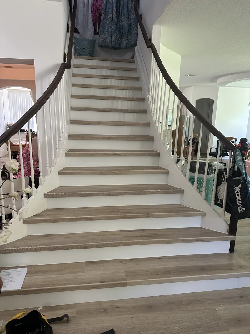 Completed curved Wellington staircase with light gray flooring