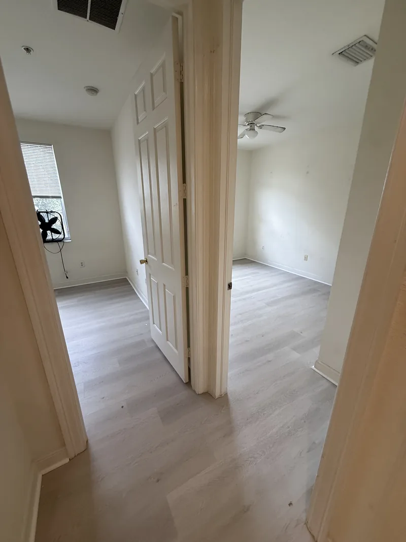 The same upper-floor hall after light flooring was installed