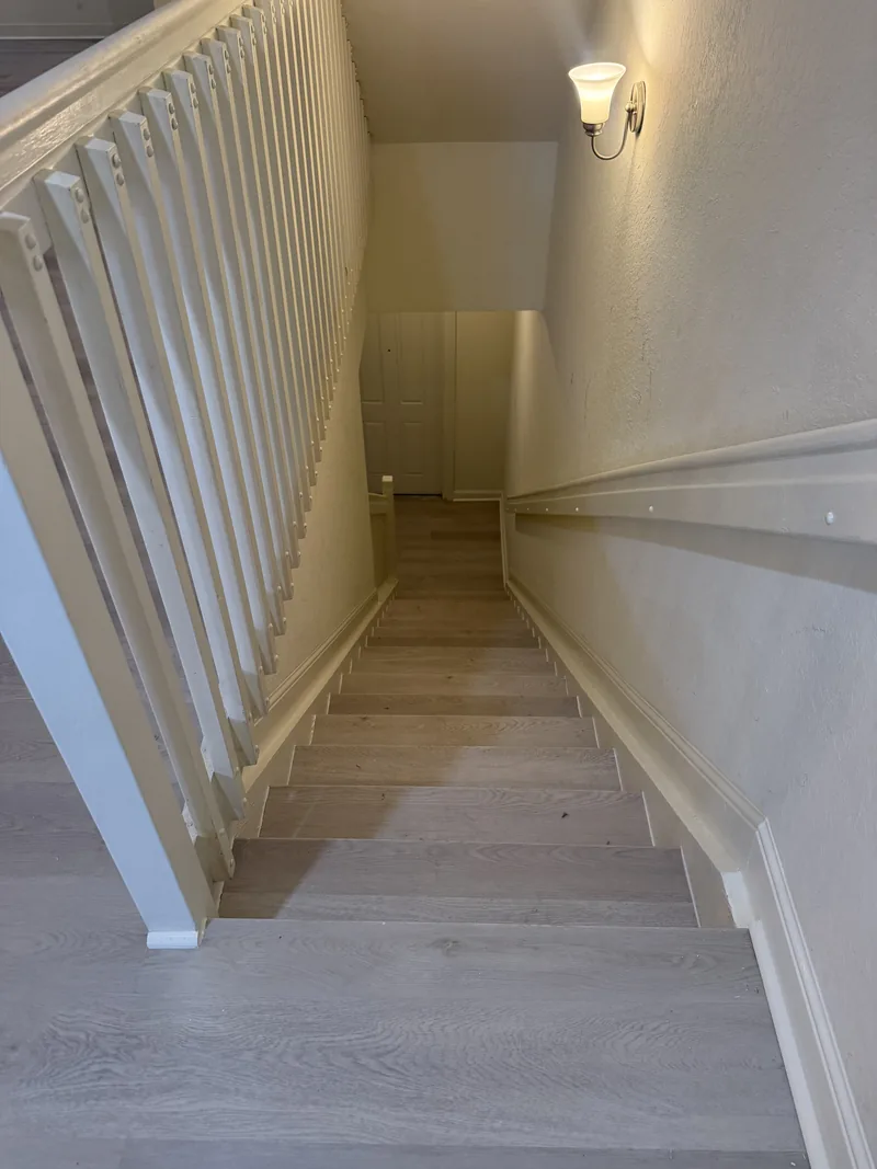 Finished staircase viewed from the upper landing