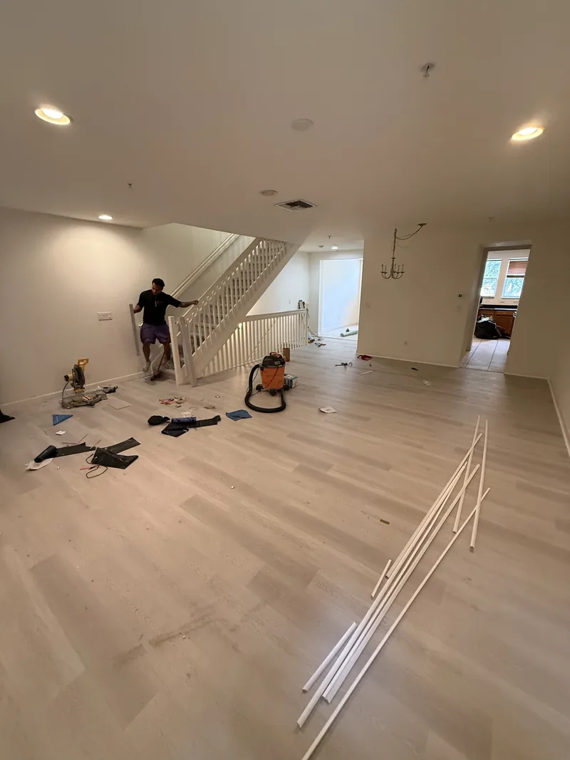 Flooring installation in progress in the living area