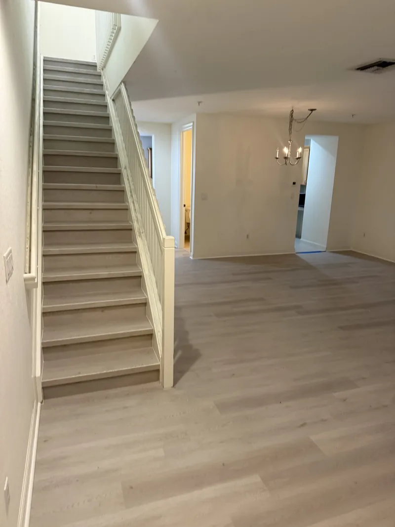 Wide view of the finished living area and staircase