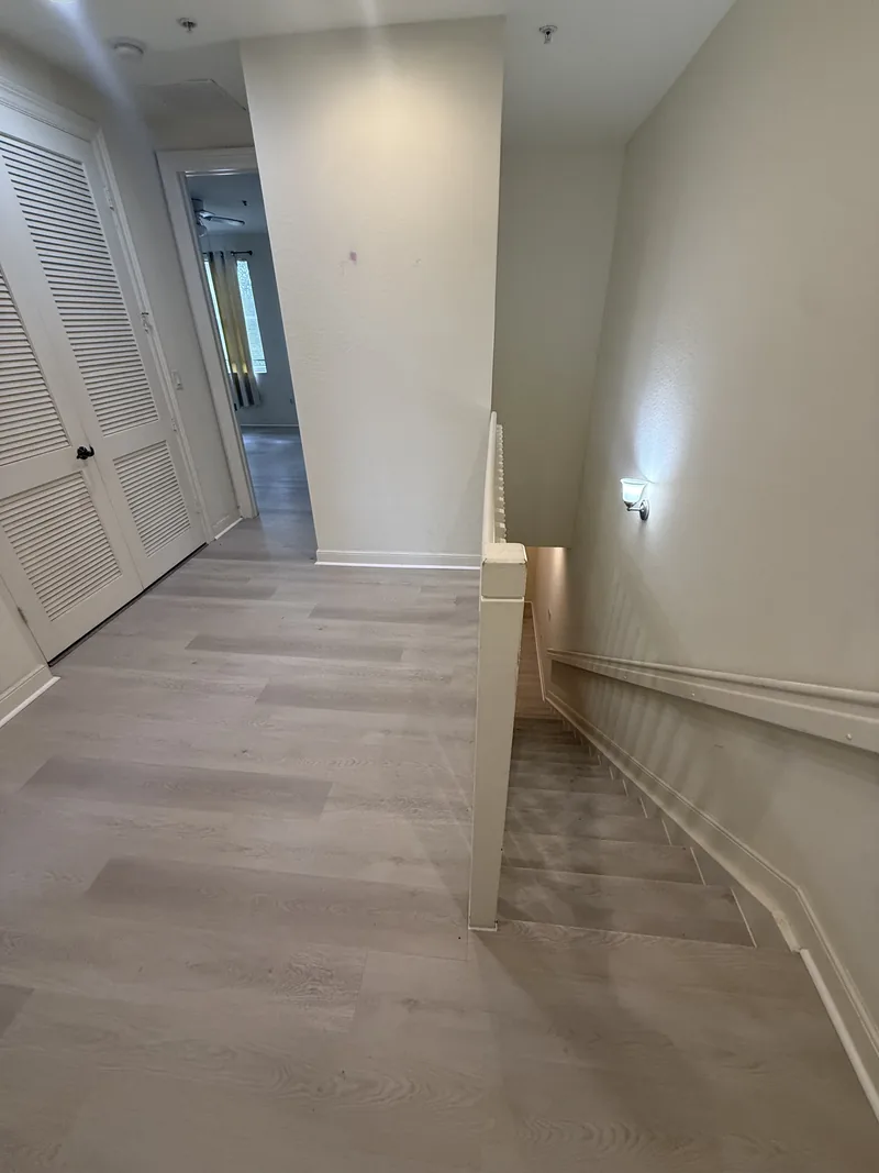 Finished upper-floor landing beside the staircase and hallway